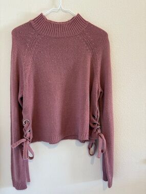 Dark Pink mock neck sweater with grommet and bow details